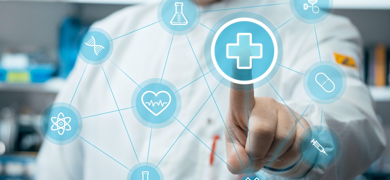 Male doctor using healthcare application on touch screen in medical laboratory.