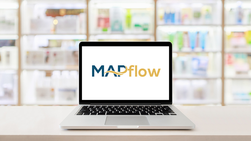 Laptop computer blank screen on pharmacy counter drugstore shop interior with medicines vitamins supplement and healthcare product on shelves blur background